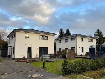 Neubau von zwei Einfamilienhäusern im Toscana Stil